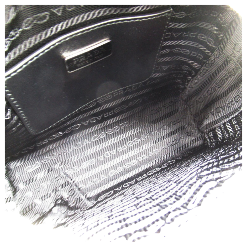 Sac Camera bag PRADA bandoulière nylon recyclé cuir noir logo triangle émail