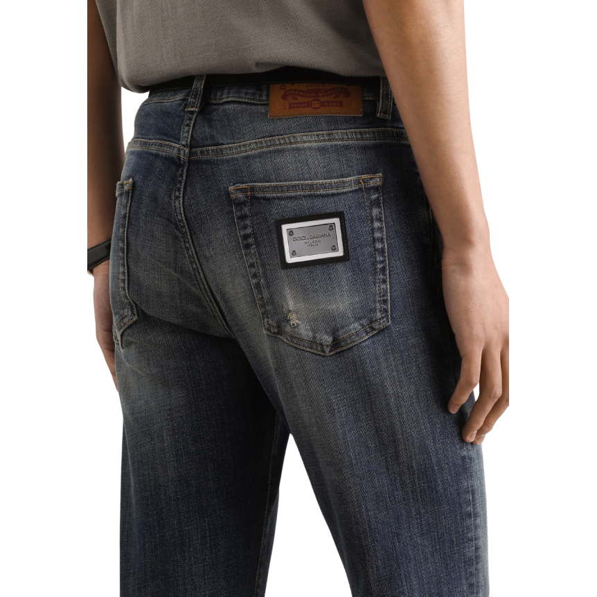 Jean slim DOLCE & GABBANA denim coton bleu délavé accrocs plaque métal poche arrière