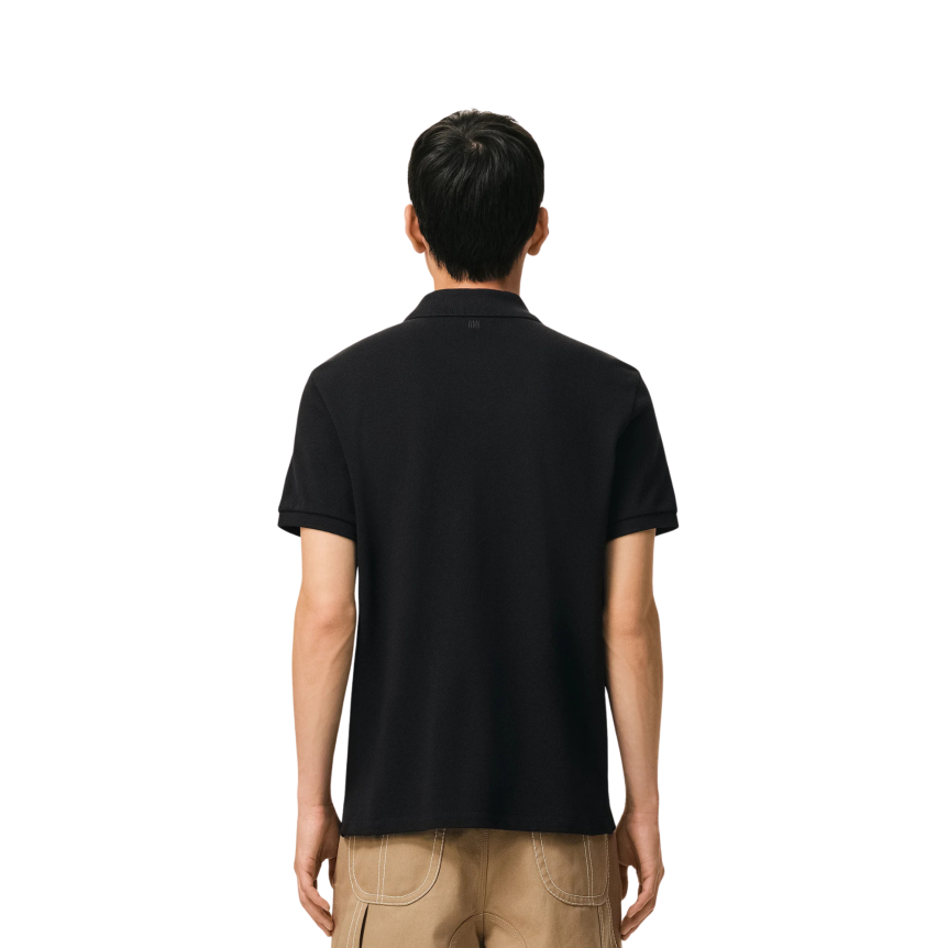 Polo manche courte AMI Paris piqué de coton noir broderie cœur blanc