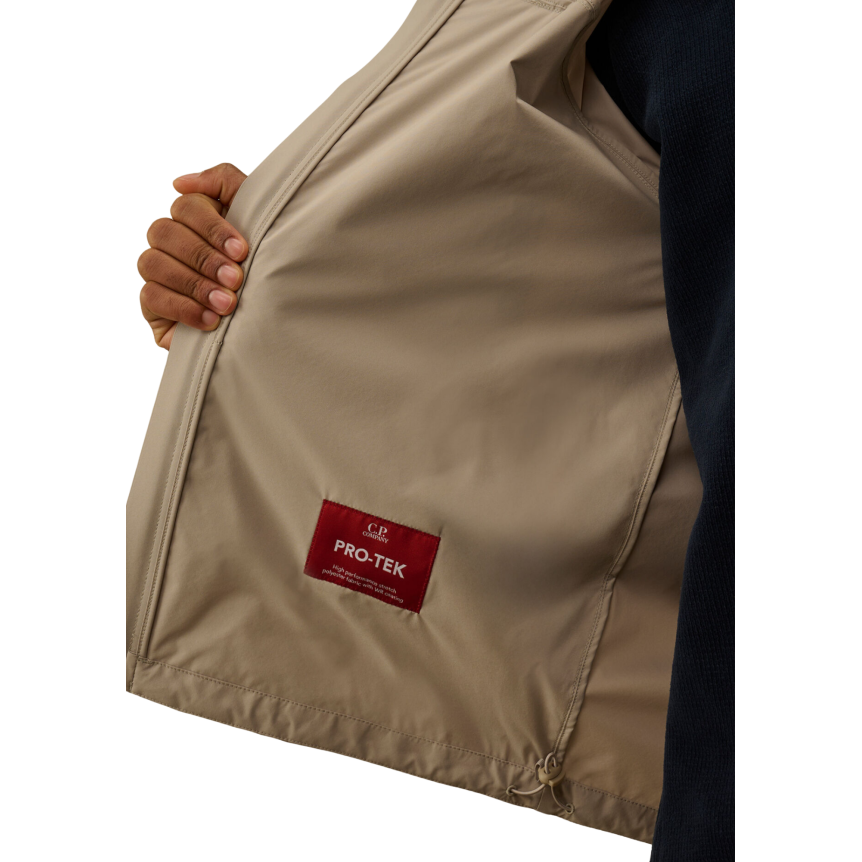 Blouson zippé à capuche CP COMPANY Pro-Tek gris beige lentille poche manche