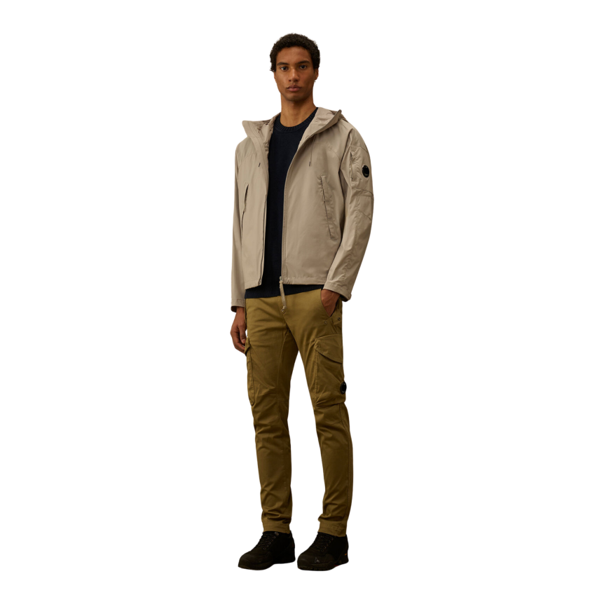 Blouson zippé à capuche CP COMPANY Pro-Tek gris beige lentille poche manche