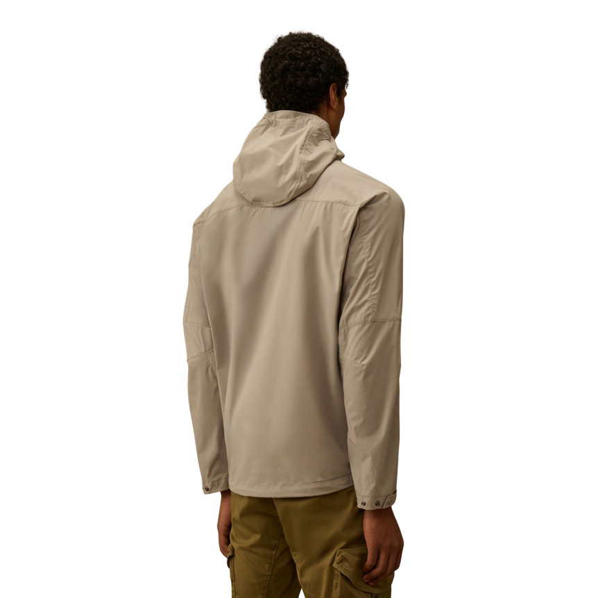 Blouson zippé à capuche CP COMPANY Pro-Tek gris beige lentille poche manche