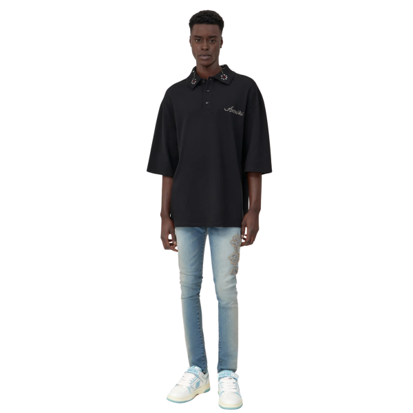 Jean skinny AMIRI denim stretch bleu délavé broderie MA QUAD