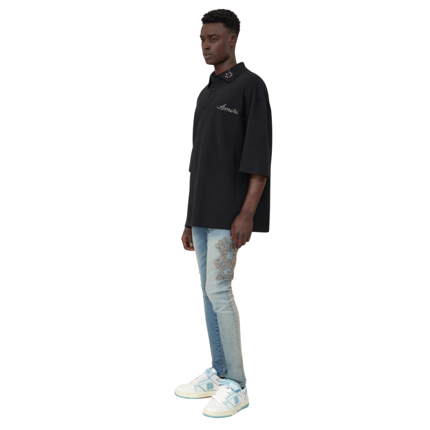 Jean skinny AMIRI denim stretch bleu délavé broderie MA QUAD