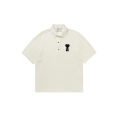 Polo manche courte piqué de coton écru broderie coeur noir