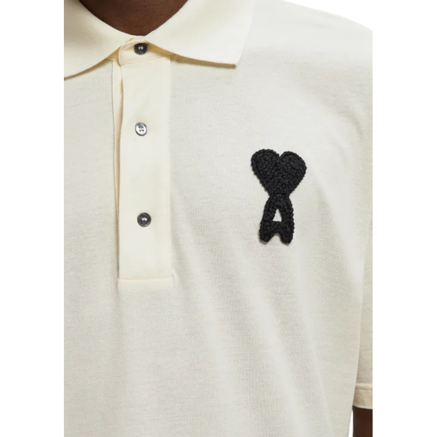 Polo manche courte AMI Paris piqué de coton écru broderie coeur noir