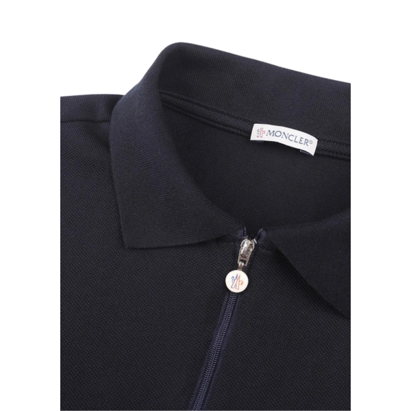 Polo MONCLER piqué de coton bleu marine col demi zip bas nylon