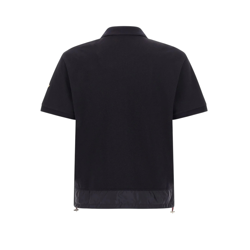 Polo MONCLER piqué de coton bleu marine col demi zip bas nylon