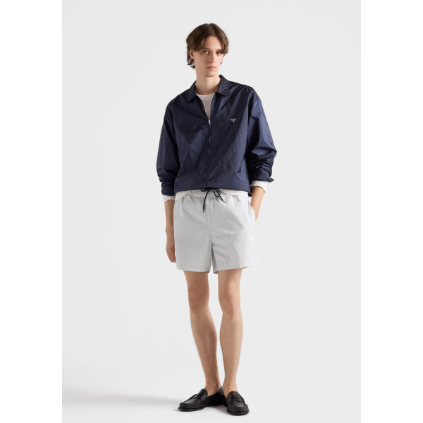 PRADA Blouson col chemise ample zippée en nylon Re bleu marine logo triangle métal émail