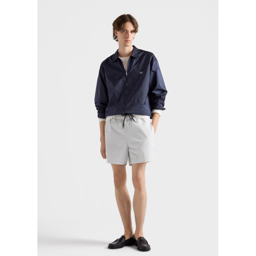 PRADA Blouson col chemise ample zippée en nylon Re bleu marine logo triangle métal émail
