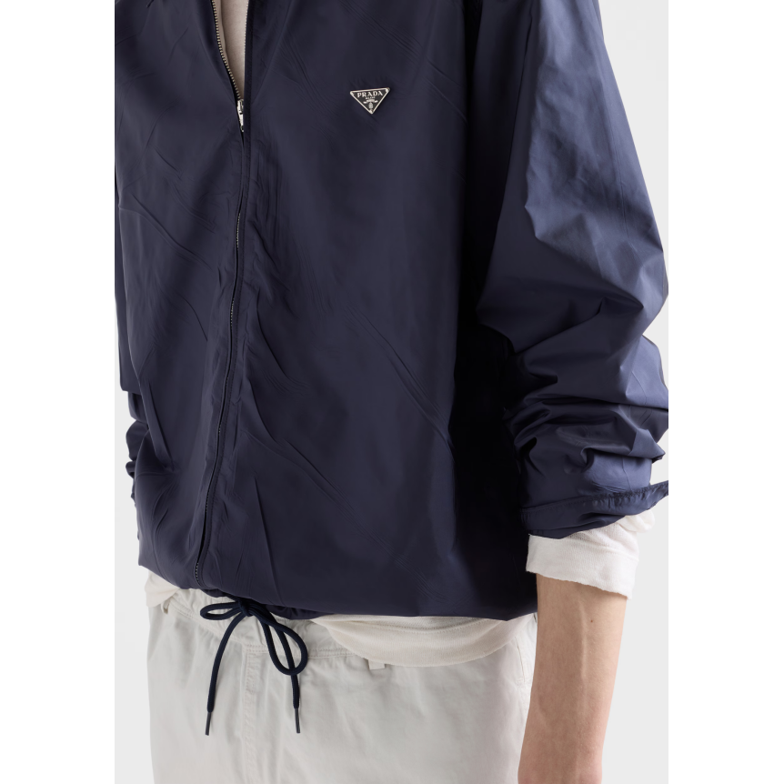 PRADA Blouson col chemise ample zippée en nylon Re bleu marine logo triangle métal émail