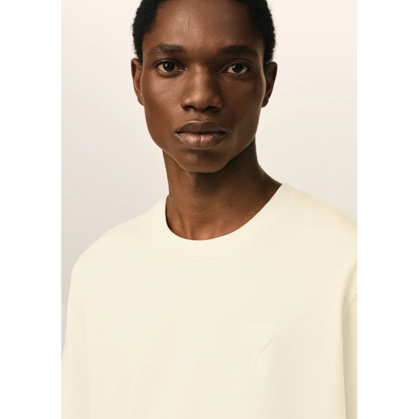 T-shirt col rond AMI Paris jersey de coton épais ivoire gros cœur embossé  ivoire