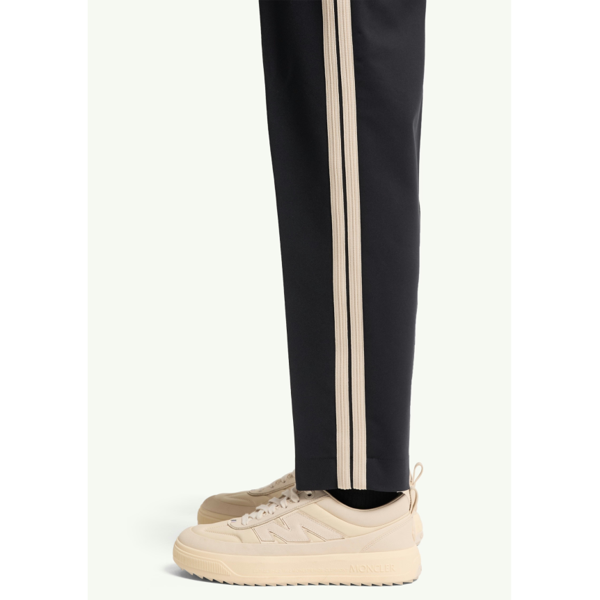 Pantalon sport MONCLER en coton mélangé bleu marine bande blanche