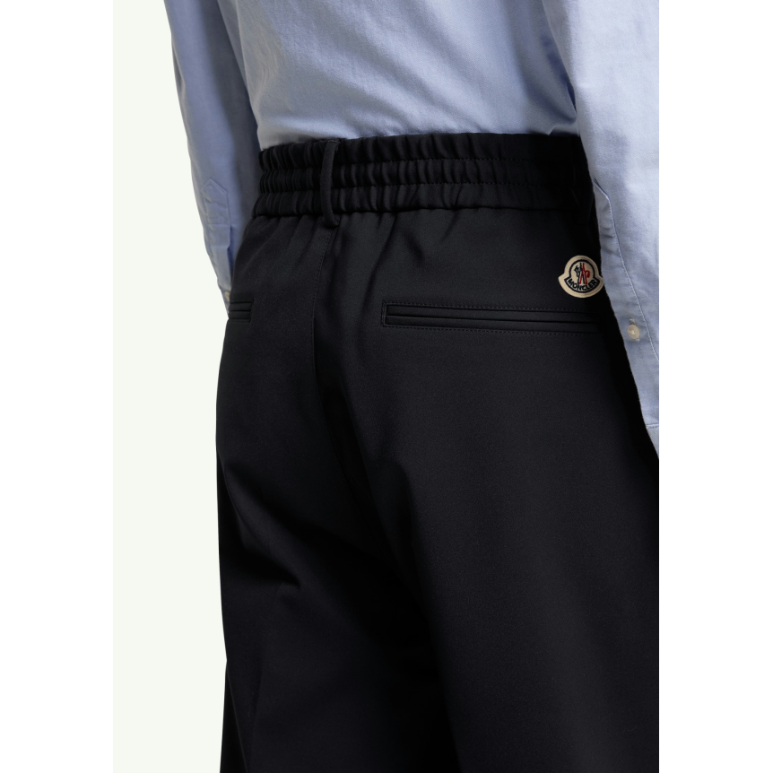 Pantalon sport MONCLER en coton mélangé bleu marine bande blanche